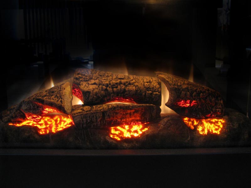 Gas logs glowing in a fireplace, providing a cozy ambiance and an alternative to traditional wood-burning fires, suitable for winter home comfort.