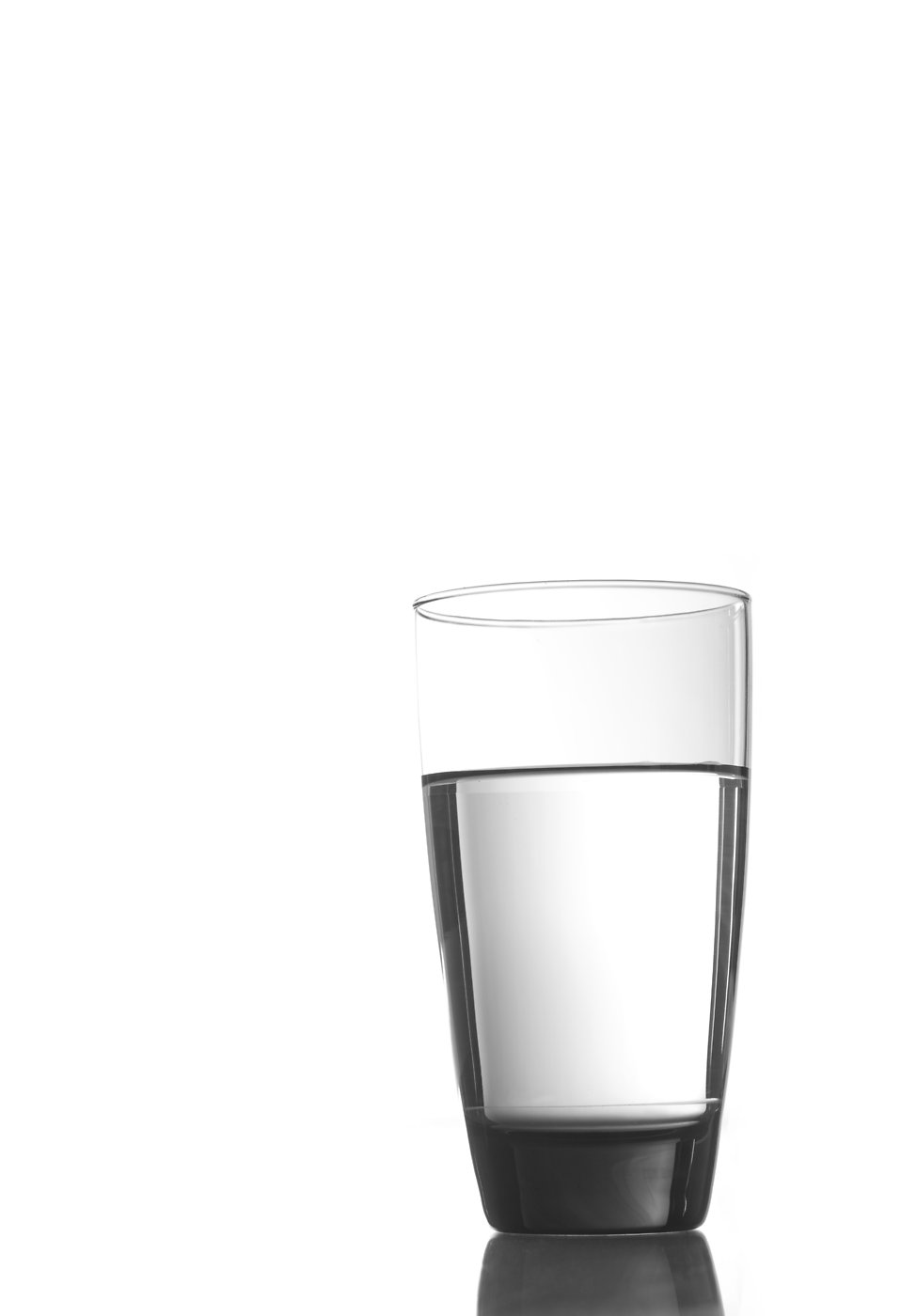 Glass of clean drinking water, highlighting purity and clarity, relevant to water conditioning and purification discussions.